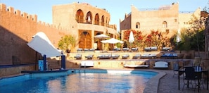 Outdoor pool, pool umbrellas, sun loungers
