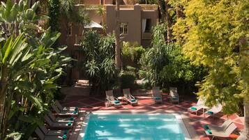 Outdoor pool, pool umbrellas, sun loungers