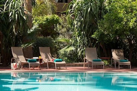 Outdoor pool, pool umbrellas, sun loungers