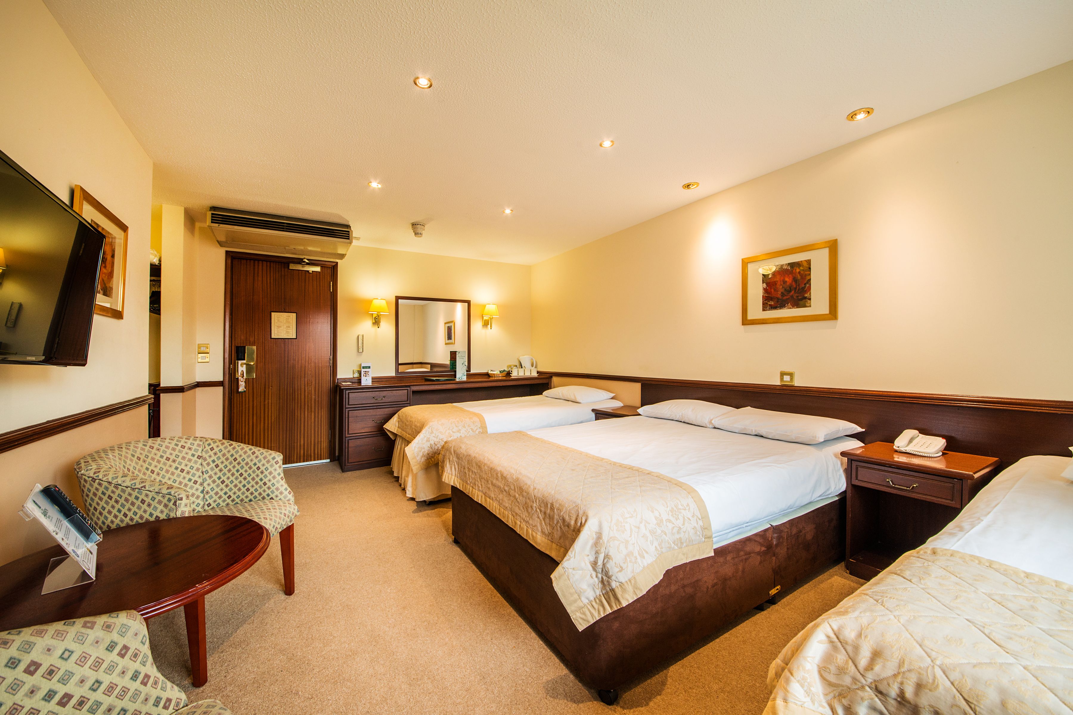 family room | desk, blackout curtains, iron/ironing board, free cots/infant beds