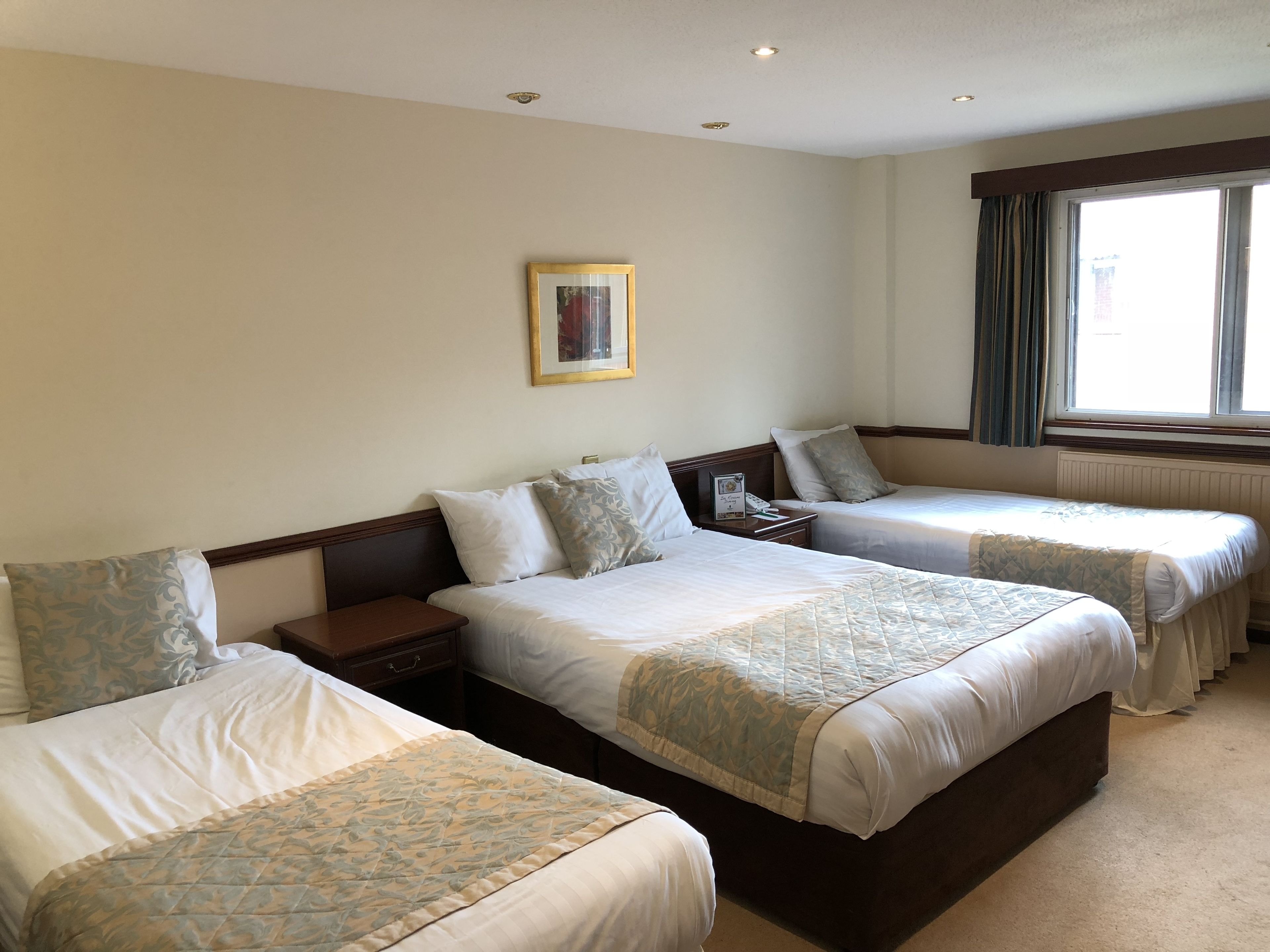 family room | desk, blackout curtains, iron/ironing board, free cots/infant beds