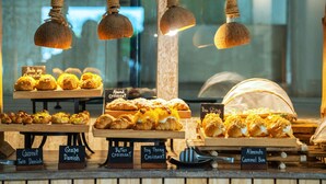 A bakery display with various pastries and breads, including labels for items like 'Coconut Twis Danish' and 'Almond Croissant'. - Wyndham Hua Hin Pranburi Resort & Villas (Pranburi)