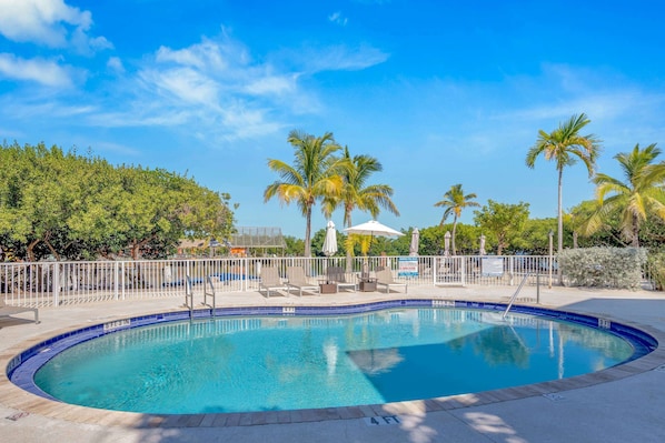 Outdoor pool, open 7 AM to 8 PM, pool umbrellas, pool loungers