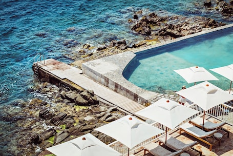 2 outdoor pools, pool umbrellas, sun loungers. Les Roches Rouges, a Beaumier hotel