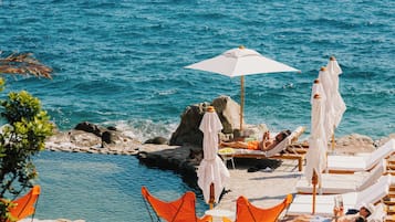 2 outdoor pools, pool umbrellas, pool loungers
