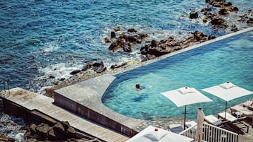 2 outdoor pools, pool umbrellas, pool loungers