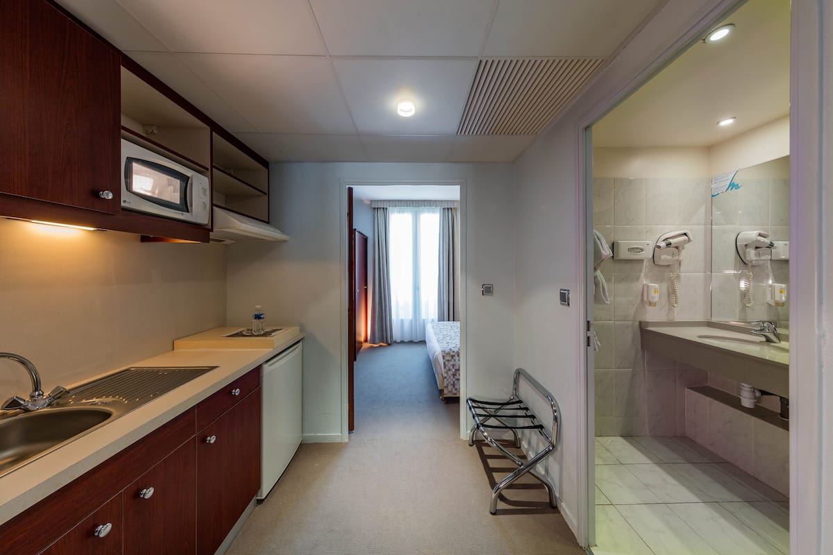 family room | premium bedding, desk, blackout curtains, iron/ironing board