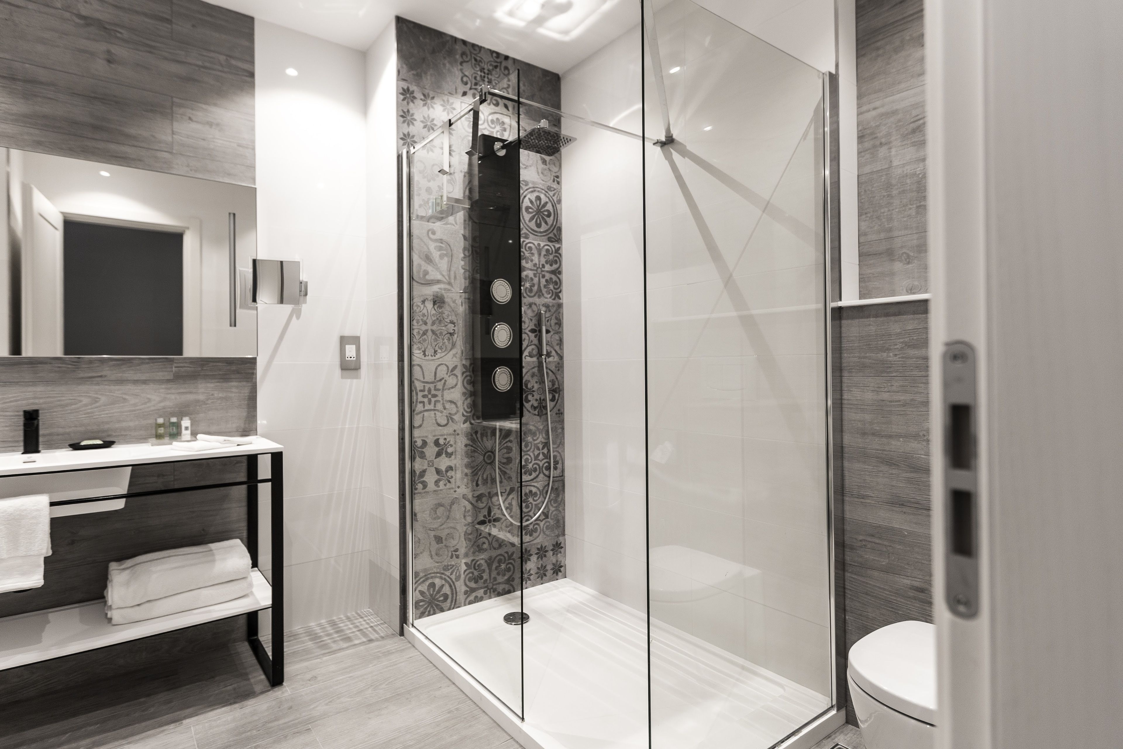 designer toiletries, hair dryer, bathrobes, towels