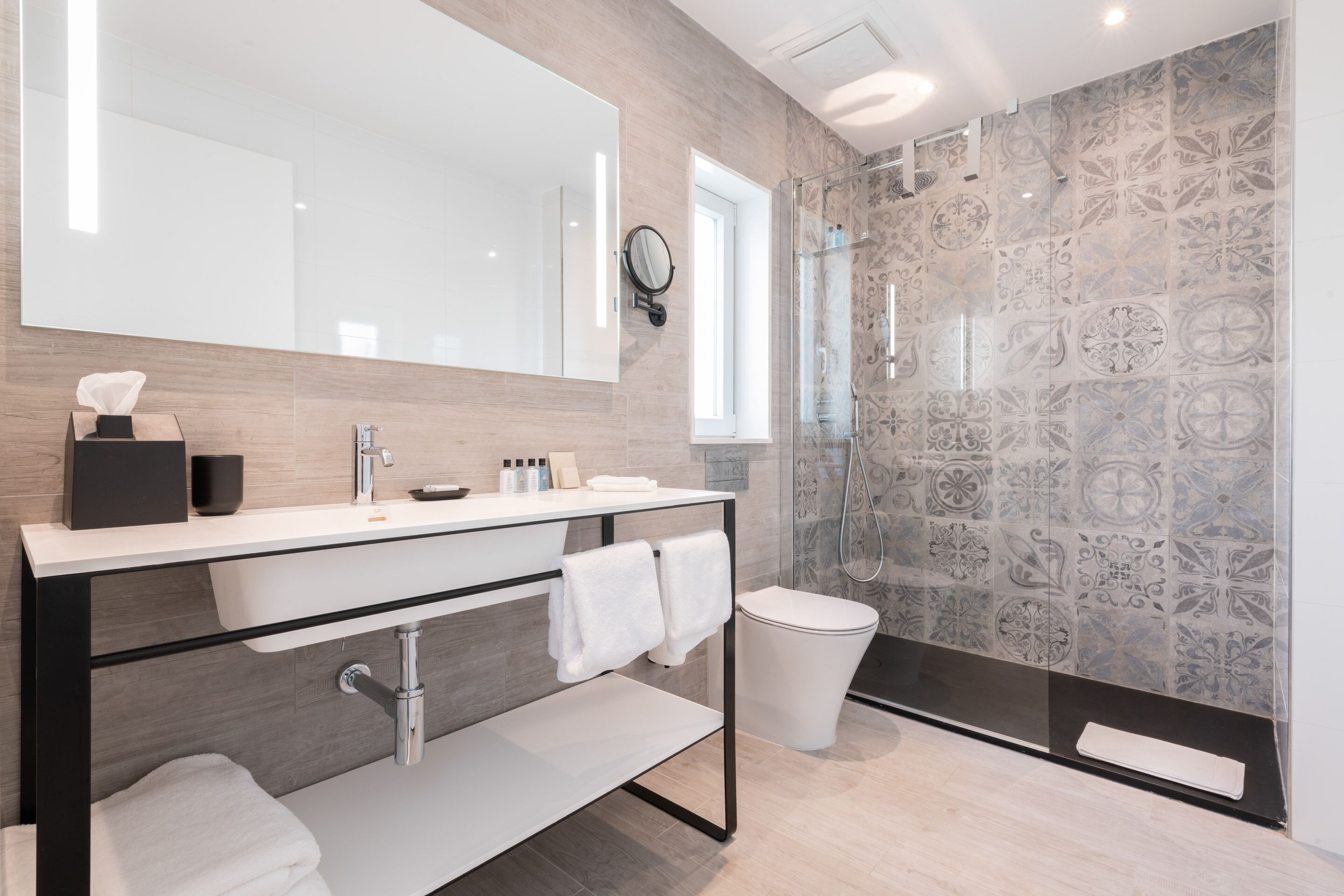 designer toiletries, hair dryer, bathrobes, towels