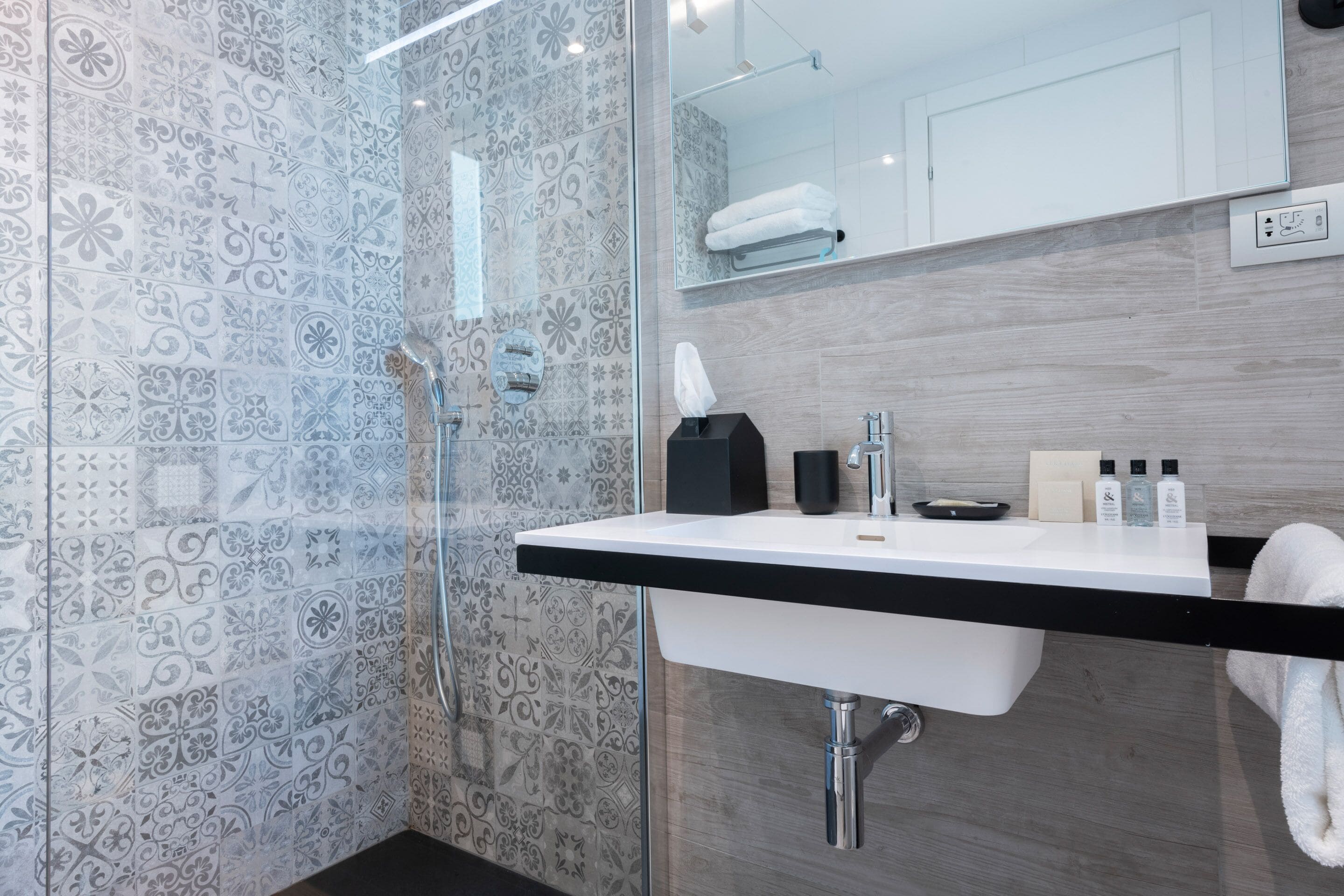 designer toiletries, hair dryer, bathrobes, towels