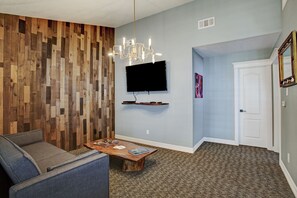 Premium Suite, 1 King Bed, Kitchen | Living room | 55-inch Smart TV with cable channels, TV - Sara's Inn On The Boulevard (Houston)