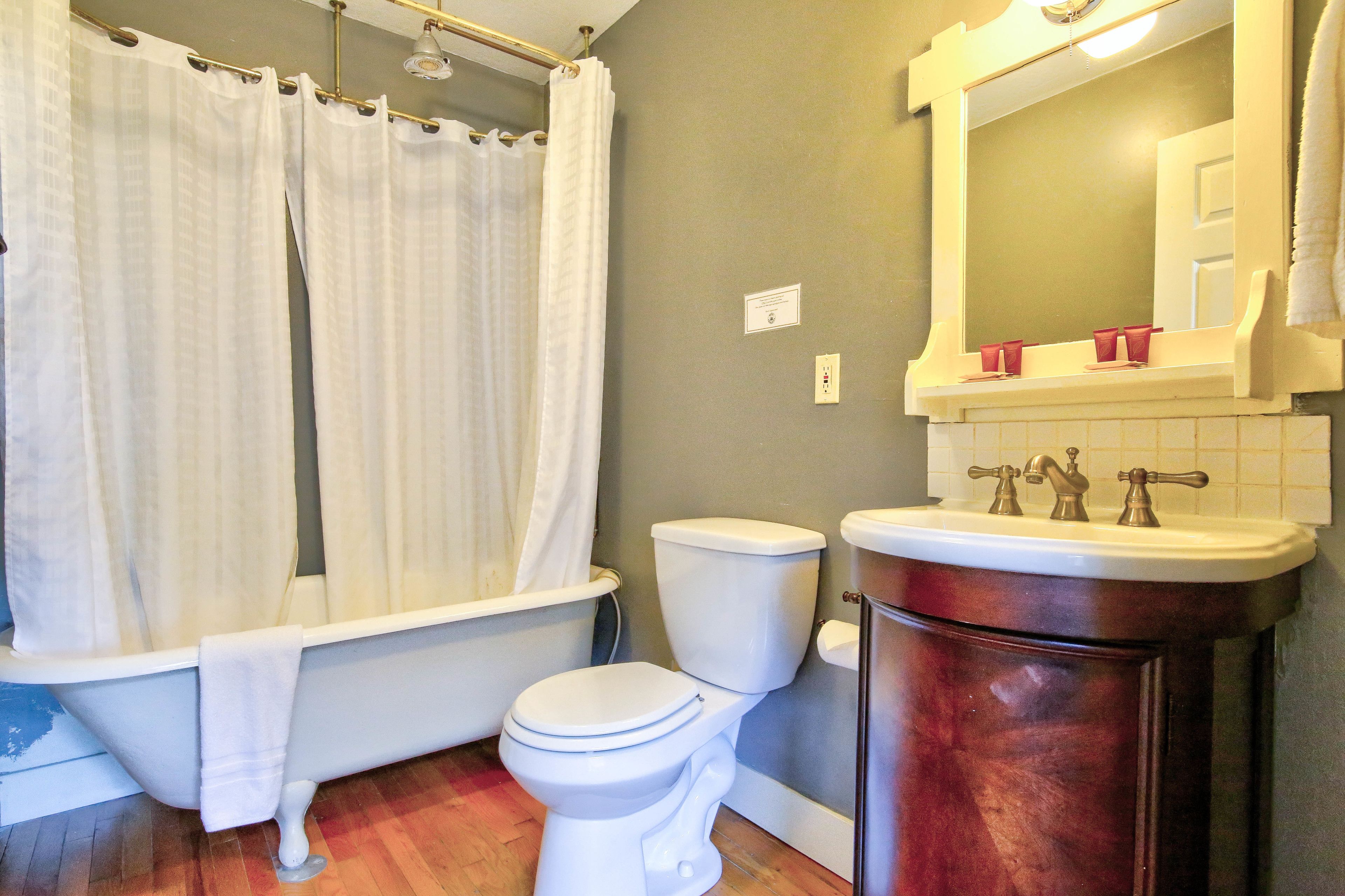 family single room, 2 queen beds | bathroom | shower, free toiletries, hair dryer, towels