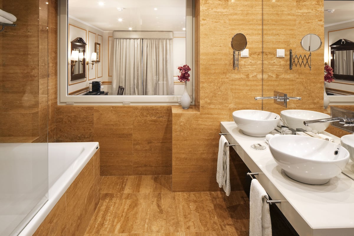 designer toiletries, hair dryer, bathrobes, slippers