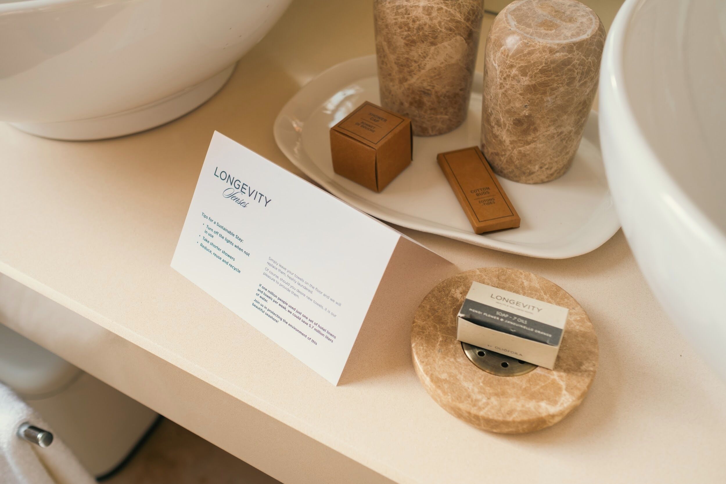 deluxe room | bathroom | designer toiletries, hair dryer, bathrobes, slippers