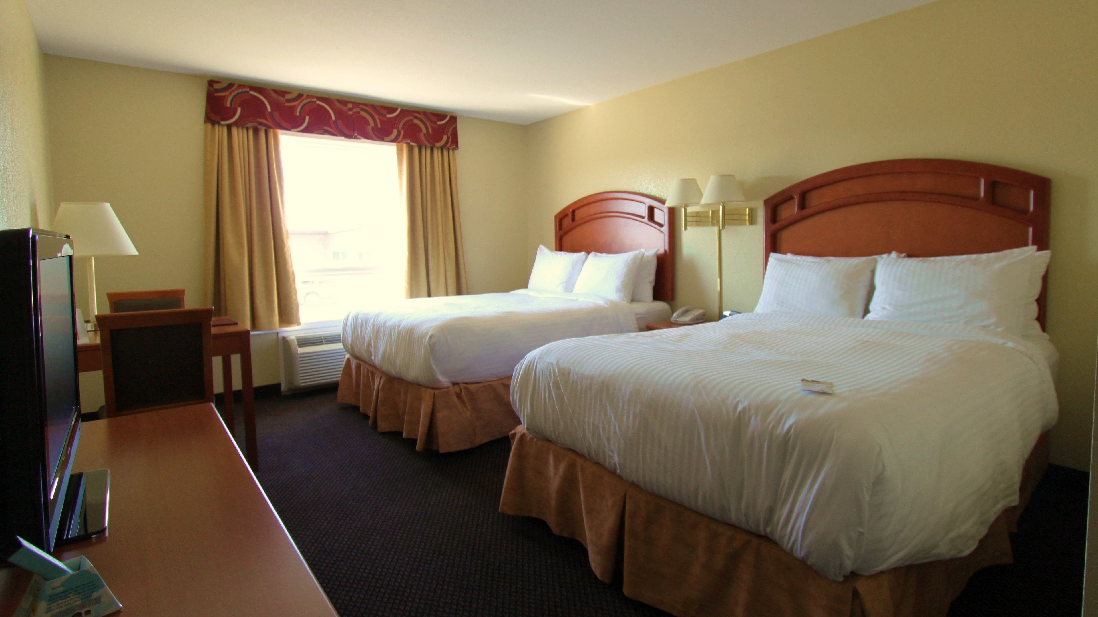 standard room, 2 queen beds | desk, iron/ironing board, free cots/infant beds, rollaway beds