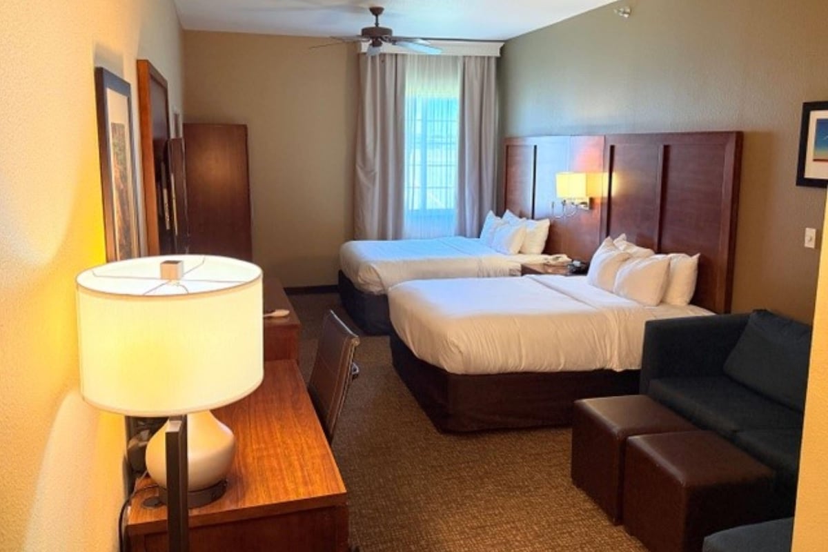 Premium bedding, desk, laptop workspace, iron/ironing board