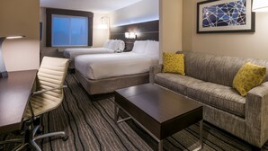 A hotel room with two beds, a sofa, a coffee table, a desk, and a chair. - Holiday Inn Express Hotel & Suites Livermore by IHG (Livermore)
