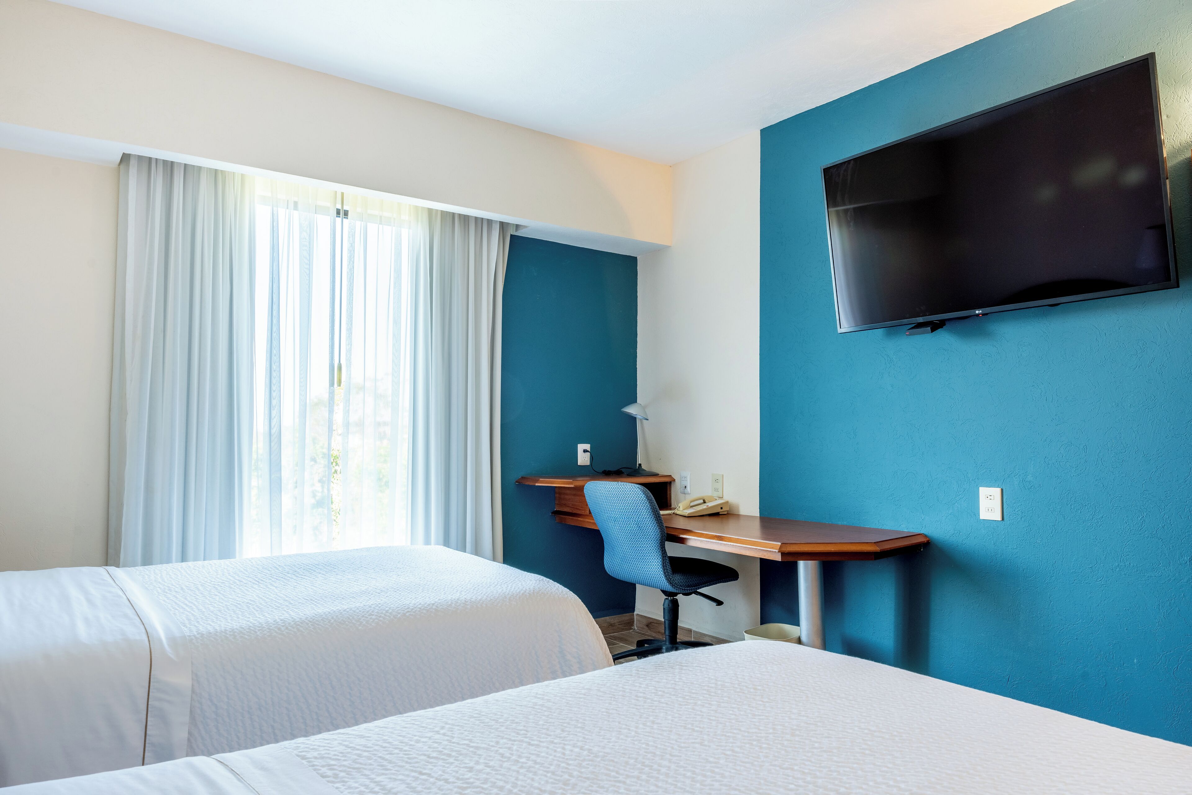 superior room, 2 double beds | premium bedding, desk, iron/ironing board, free wifi