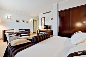 Premium bedding, down comforters, pillowtop beds, minibar