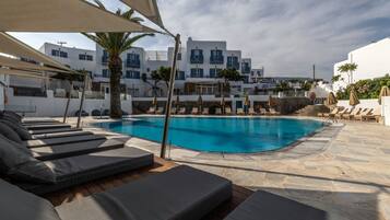 Outdoor pool, pool umbrellas, sun loungers