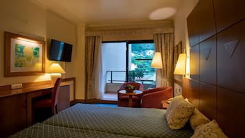 Standard Double or Twin Room | Minibar, in-room safe, blackout curtains, bed sheets