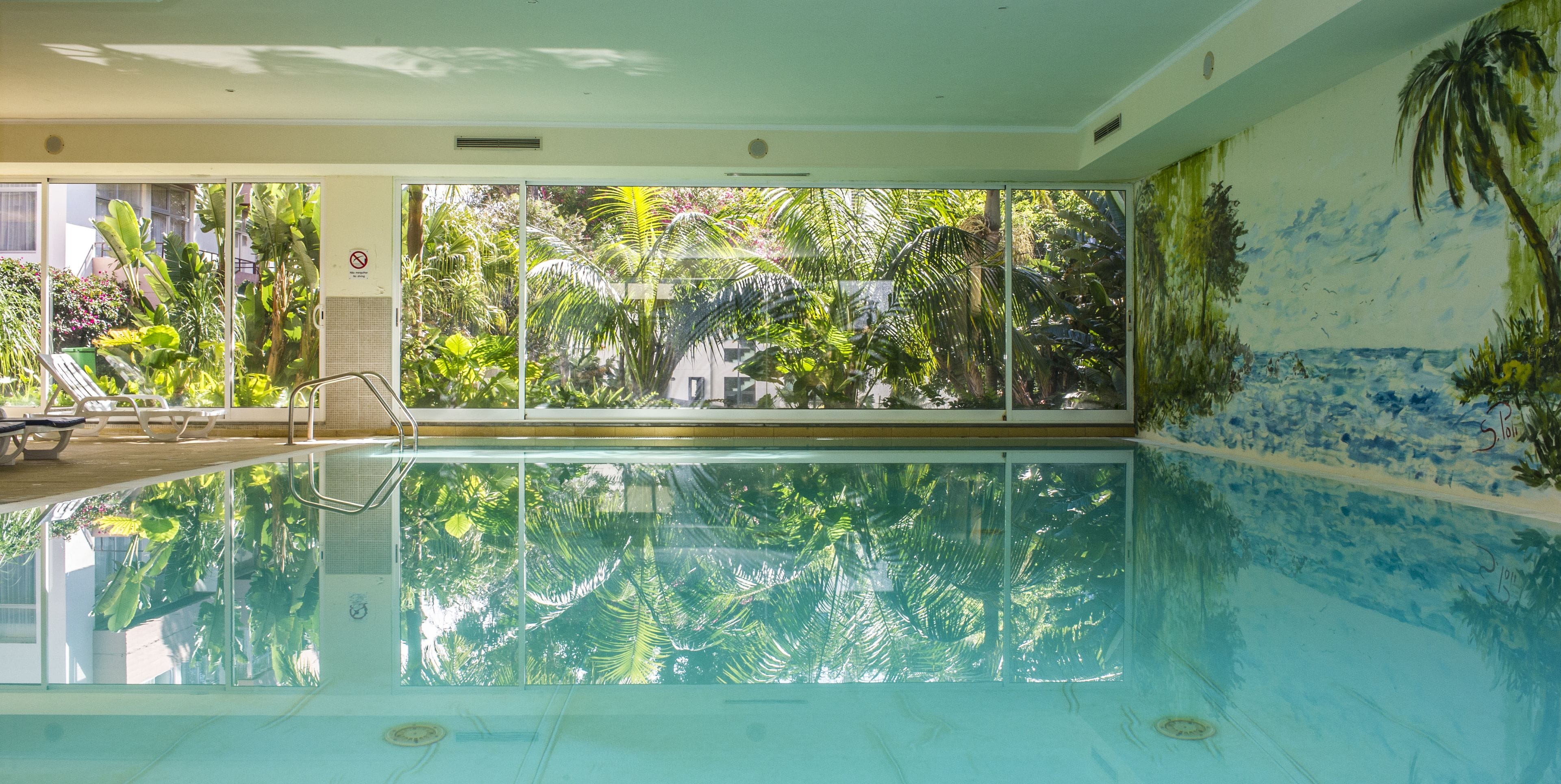 Indoor pool, outdoor pool, pool umbrellas, sun loungers