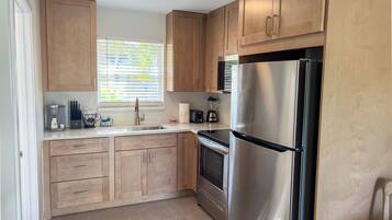Studio, 1 King Bed, Mobility Accessible, Poolside | Private kitchen | Fridge, microwave, coffee/tea maker, freezer
