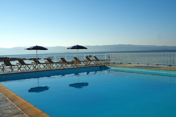 Outdoor pool, pool umbrellas, pool loungers