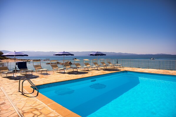 Outdoor pool, pool umbrellas, sun loungers