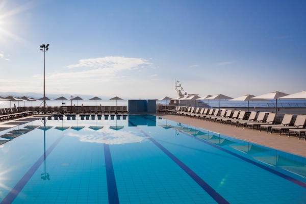 Indoor pool, seasonal outdoor pool, pool umbrellas, pool loungers
