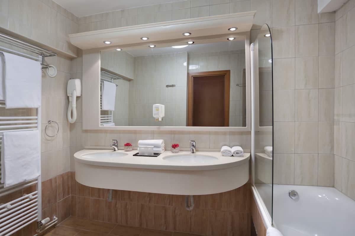 superior twin room | bathroom | hair dryer, slippers, towels, soap
