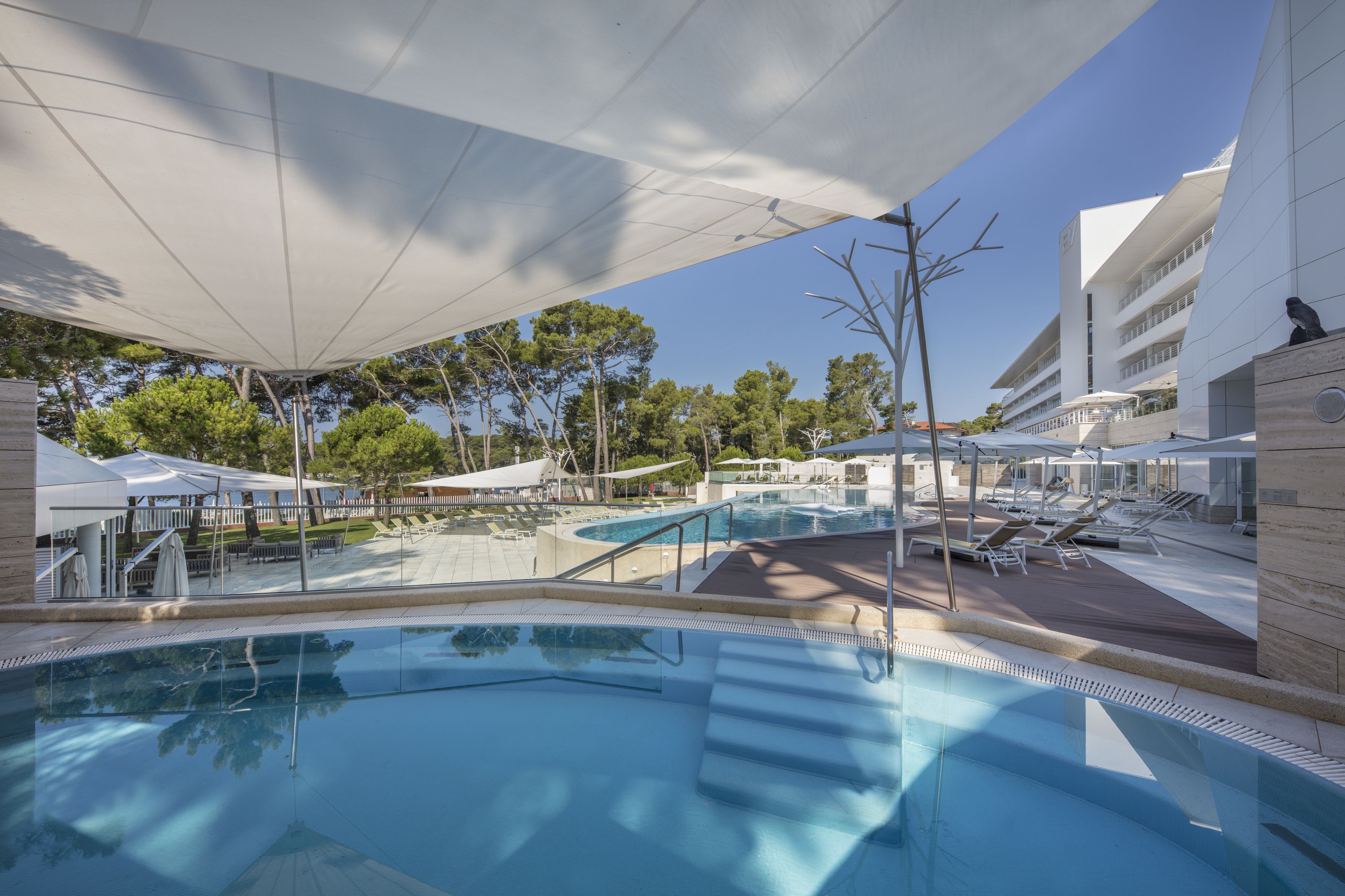 indoor pool, seasonal outdoor pool, open 8 am to 9 pm, pool loungers