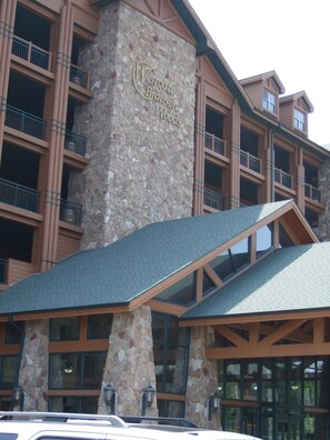 A building with a stone facade and multiple balconies.