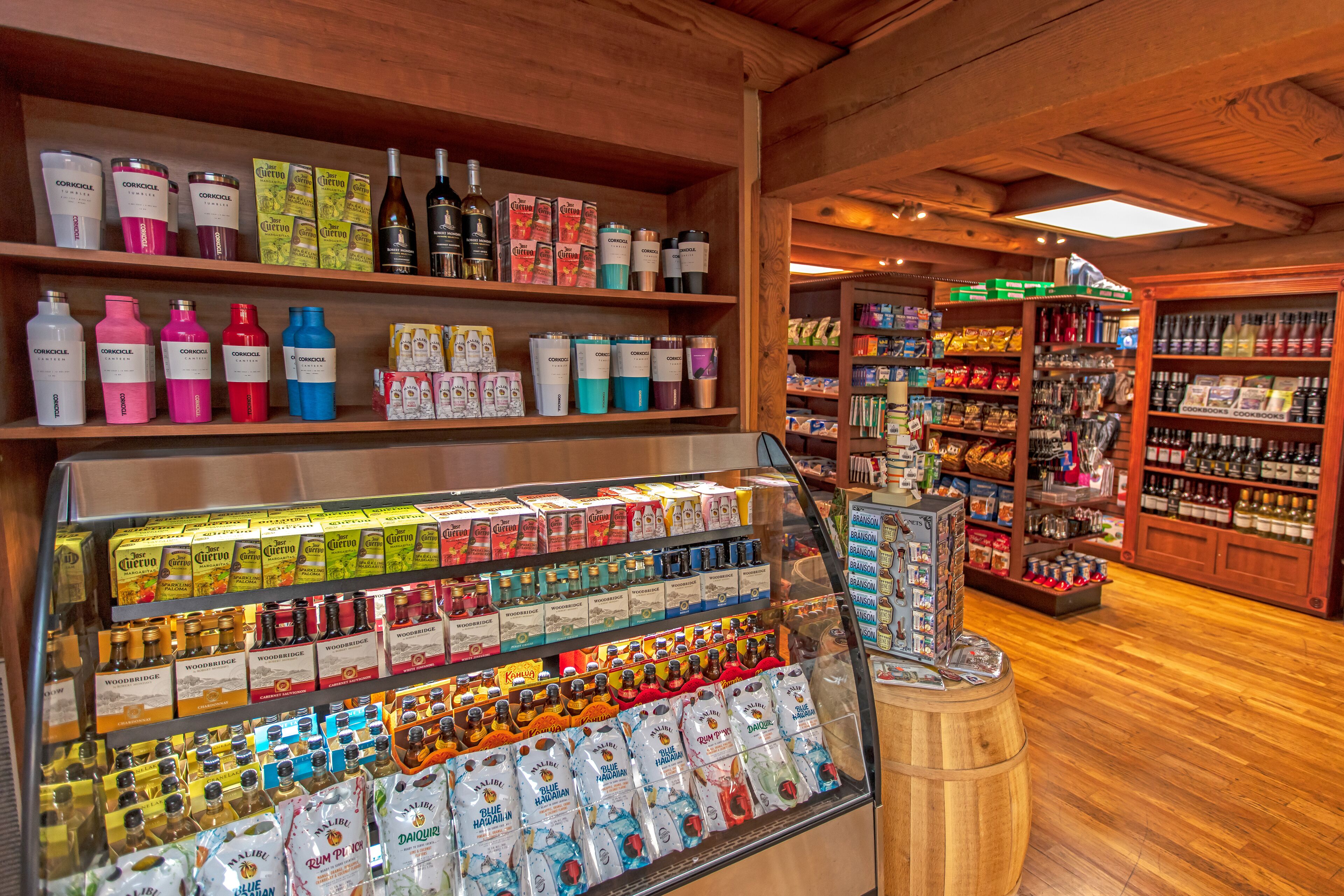 A store with shelves stocked with various products including bottles and boxes.
