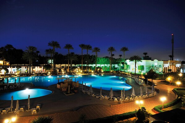 Indoor pool, outdoor pool, pool umbrellas, pool loungers