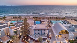 A resort with multiple swimming pools, a beach, and a view of the ocean. - Paralos Kosta Alímia (Hersonissos)