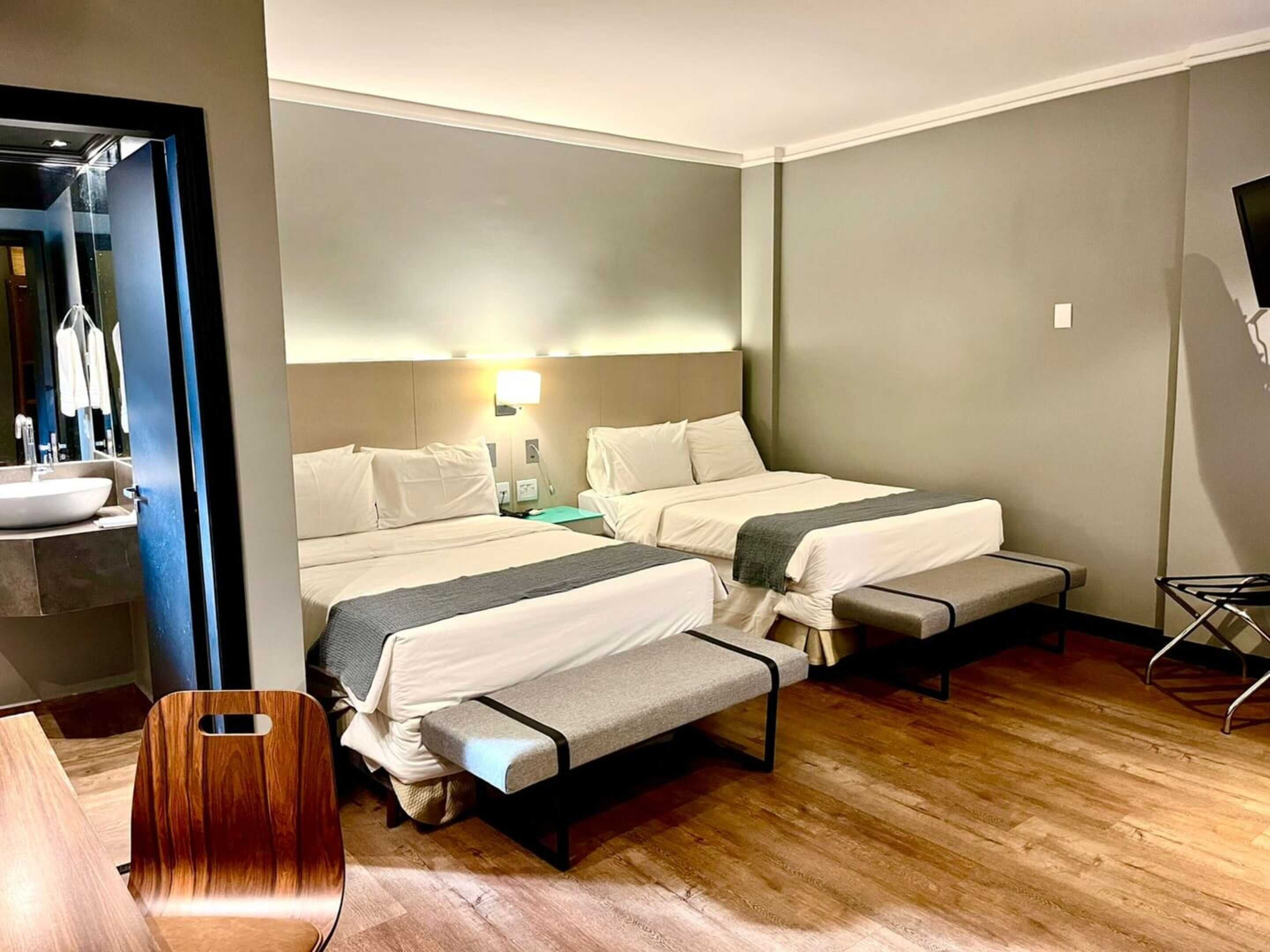 Standard Twin Room, 2 Double Beds | Minibar, in-room safe, desk, blackout drapes