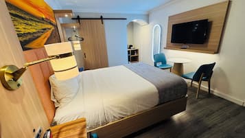 Desk, laptop workspace, blackout drapes, iron/ironing board