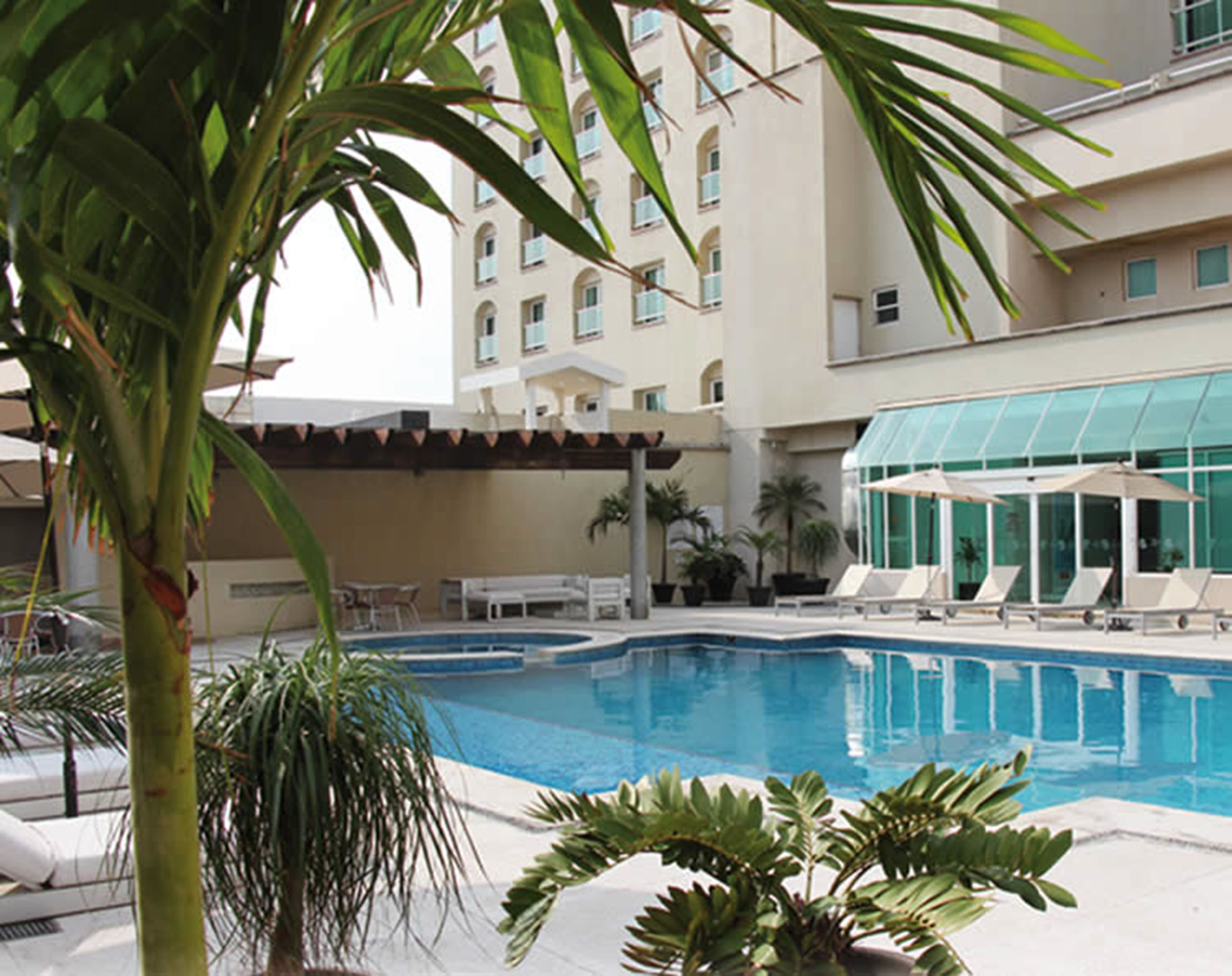 outdoor pool, open 8 am to 10 pm, pool loungers