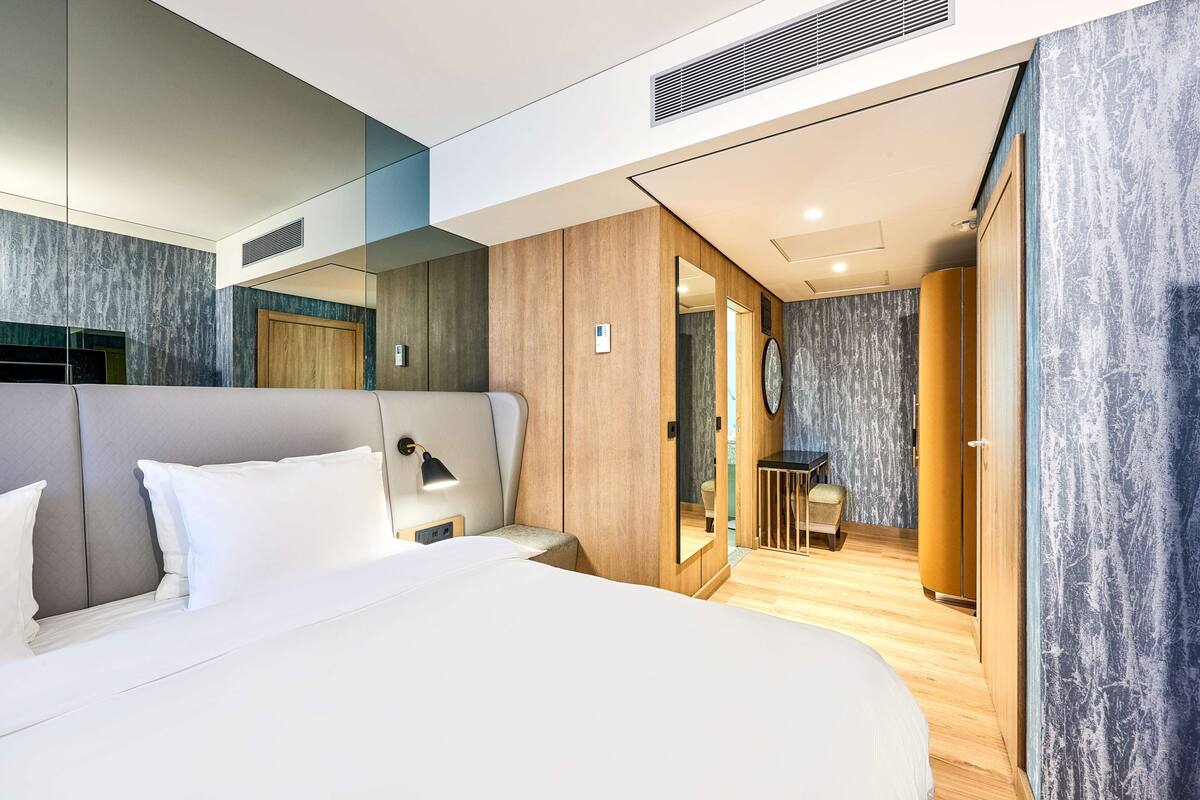 Premium bedding, down comforters, memory foam beds, minibar
