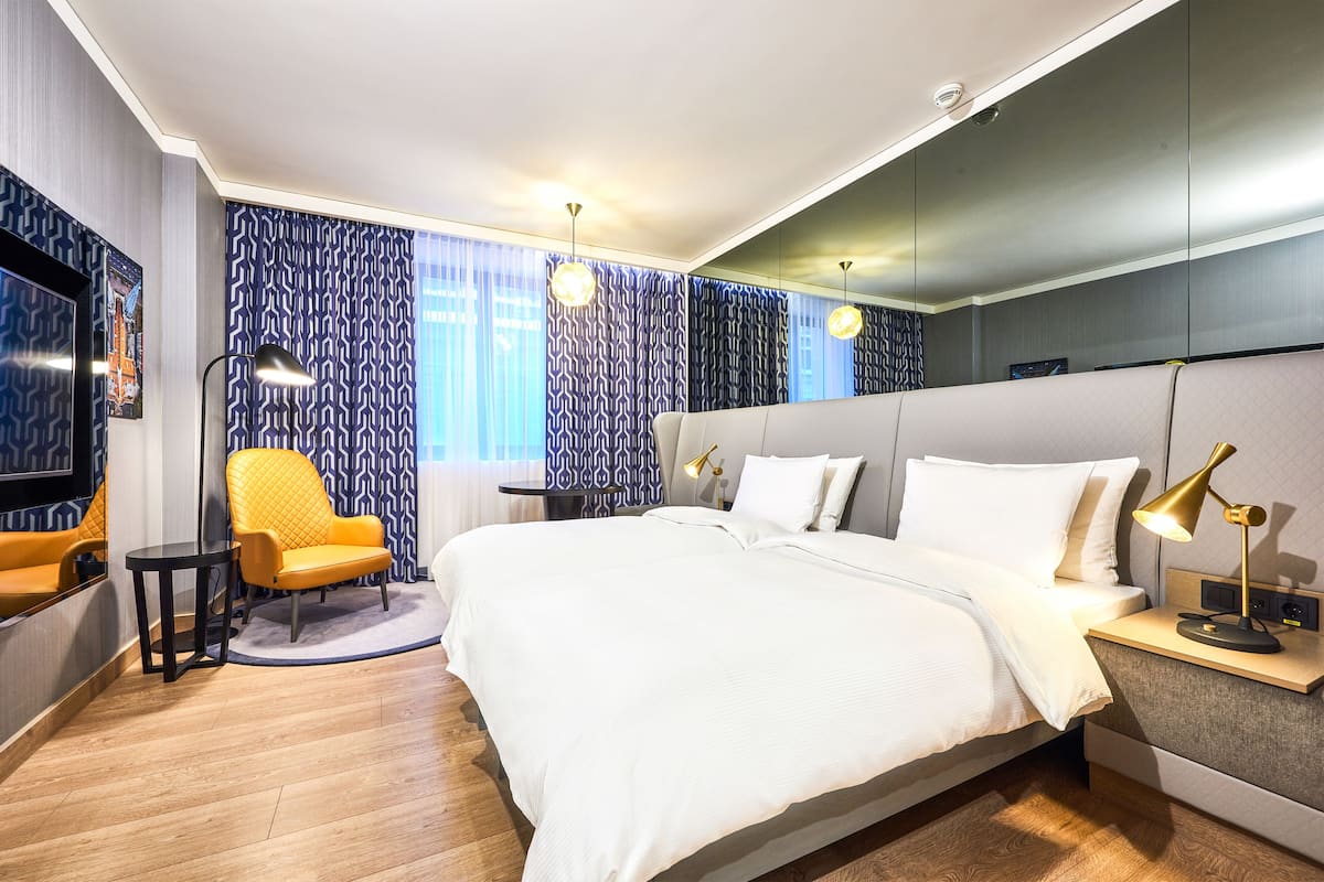 Premium bedding, down comforters, memory foam beds, minibar