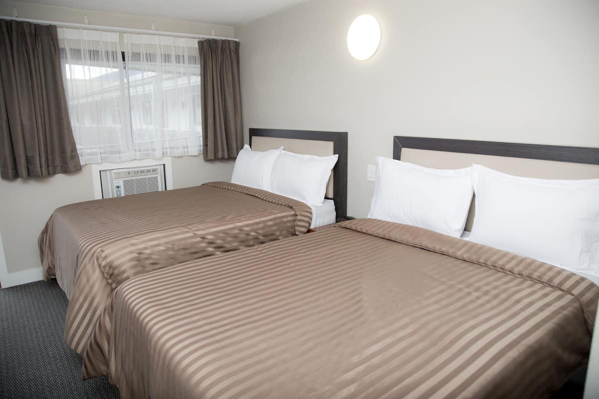 Standard Suite, 2 Double Beds | Soundproofing, free WiFi, bed sheets, alarm clocks