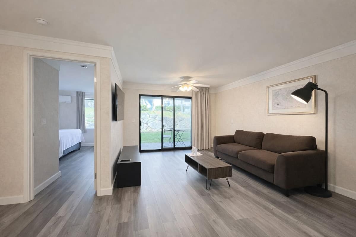 Suite, 1 King Bed | Living area | Flat-screen TV, fireplace