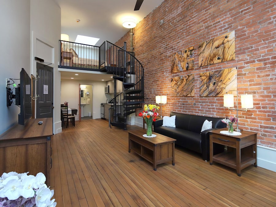 Lofted Studio (2nd and 3rd Floors) | Living area | TV