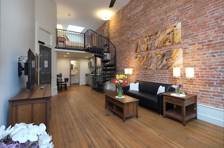 Lofted Studio (2nd and 3rd Floors) | Living area | TV