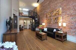 Lofted Studio (2nd and 3rd Floors) | Living area | TV