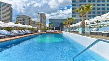 Seasonal outdoor pool, cabanas (surcharge), pool umbrellas