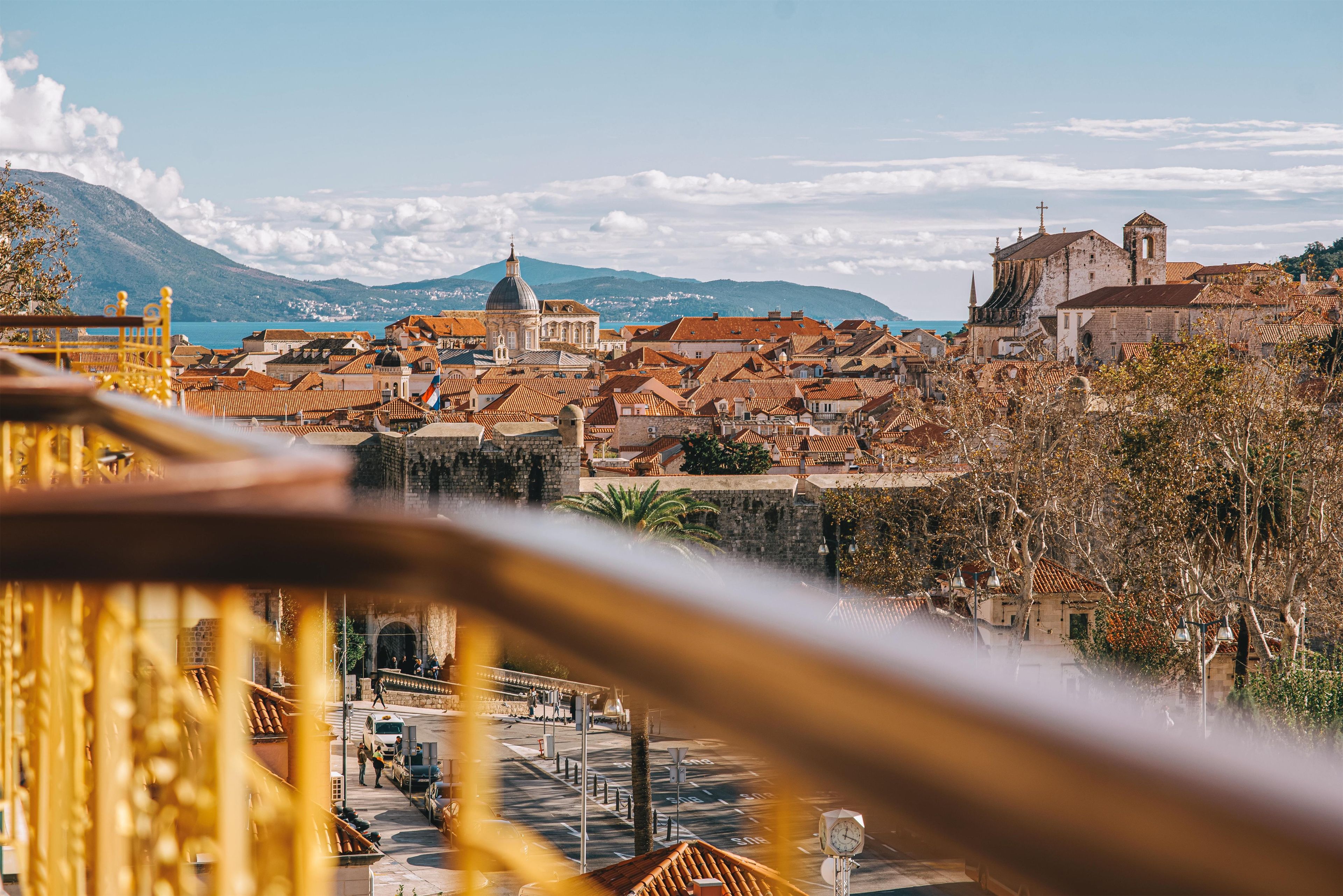 A coastal town with historic buildings and a prominent church.
