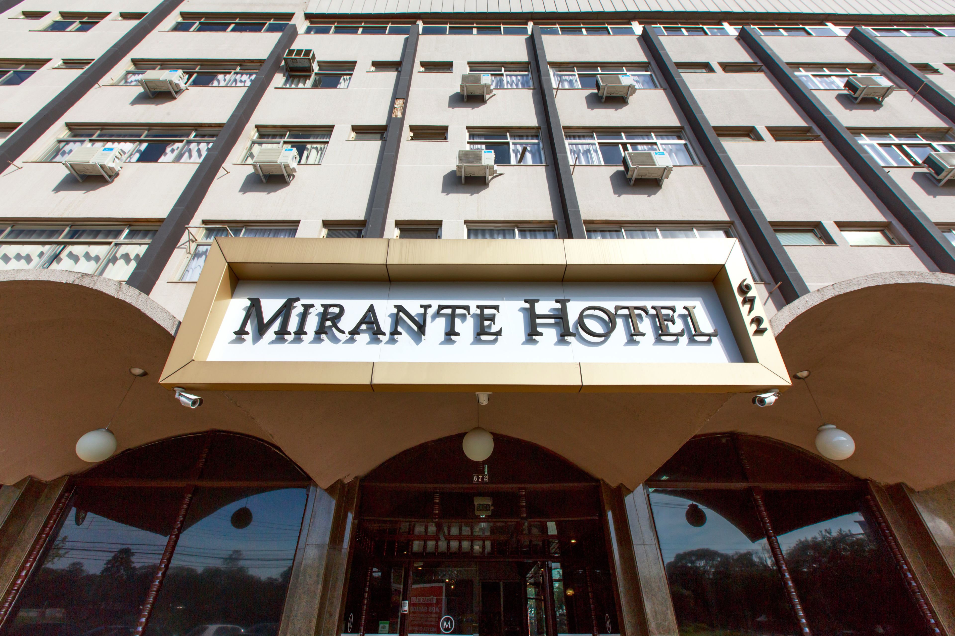 The exterior of the Mirante Hotel with a prominent sign above the entrance.