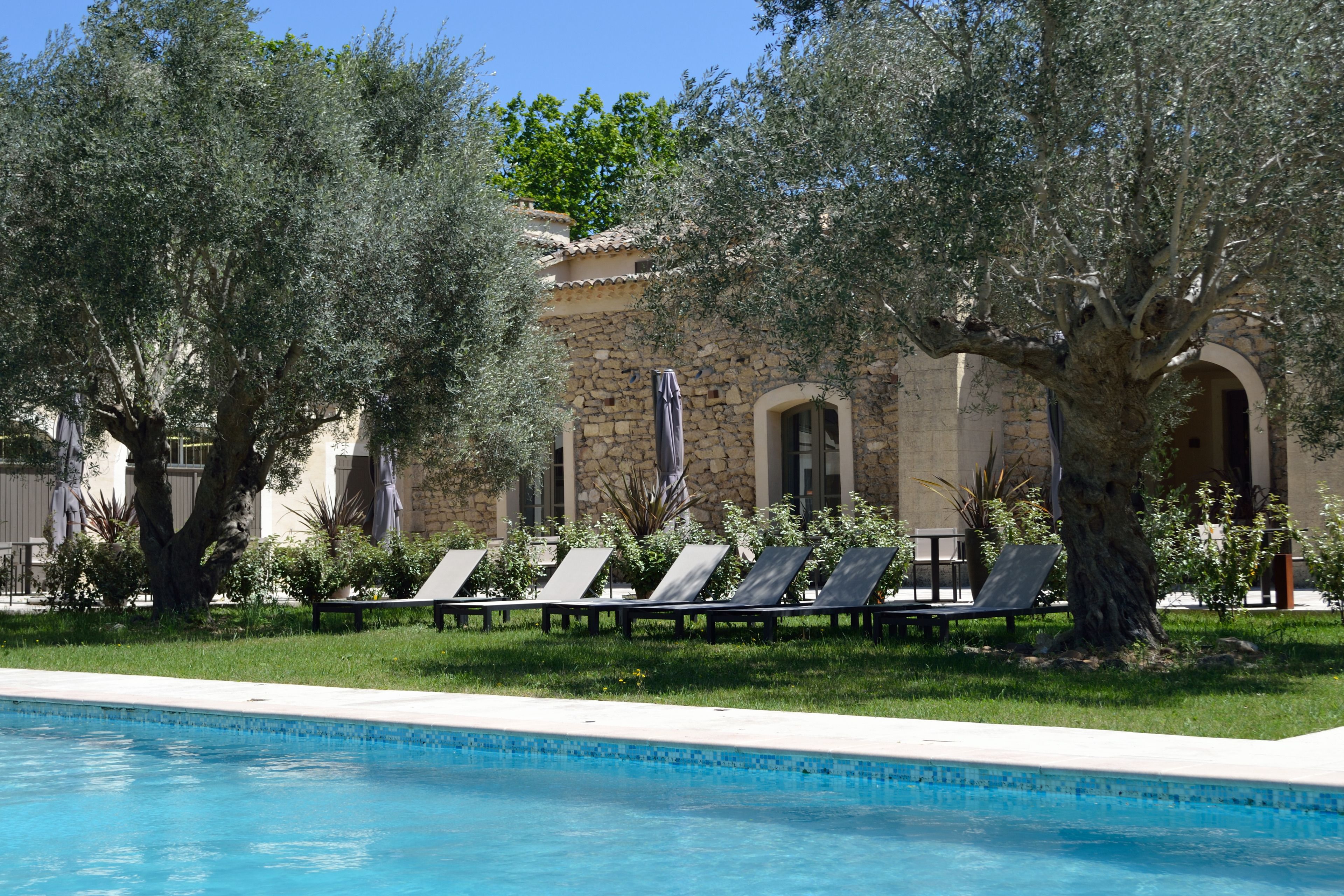 outdoor pool, pool umbrellas, pool loungers